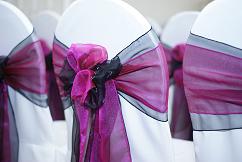 Double bowed raspberry pink and black sashes 